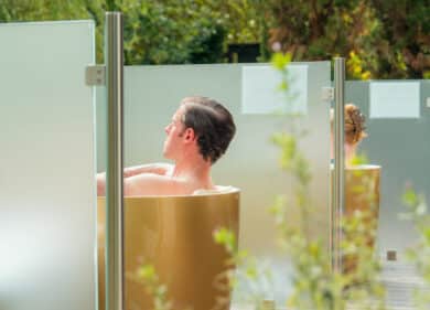 guest enjoying an outdoor copper bath at Muckross Hotel spa