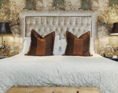 Elegant hotel room with plush king-size bed, luxurious pillows, ambient lighting, and stylish decor for a relaxing stay.