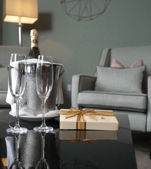 Wine and glasses on the table in a Reserve apartment living room at Muckross Park, Killarney.